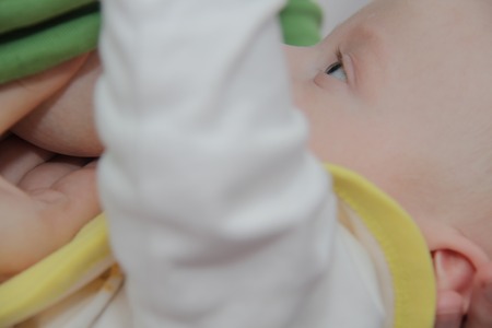 Photo of the Mom breastfeeding baby boyの写真素材