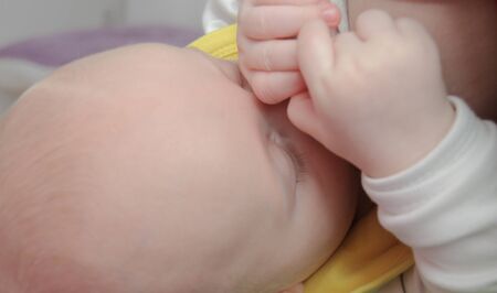 Photo of the Mom breastfeeding baby boyの写真素材