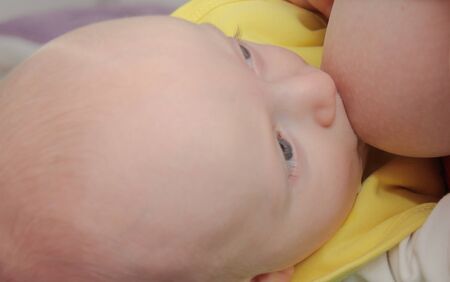 Photo of the Mom breastfeeding baby boy