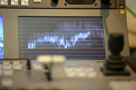 Photo of the TV editor working with video and audio mixerの写真素材