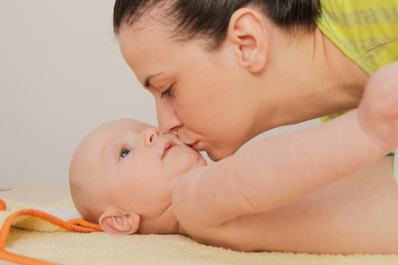 Photo of the Mother playing with hertwo months  baby boyの写真素材
