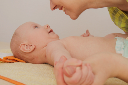 Photo of the Mother playing with hertwo months  baby boyの写真素材