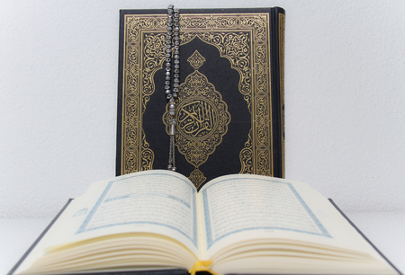 Holy islamic book Koran and rosaryの写真素材