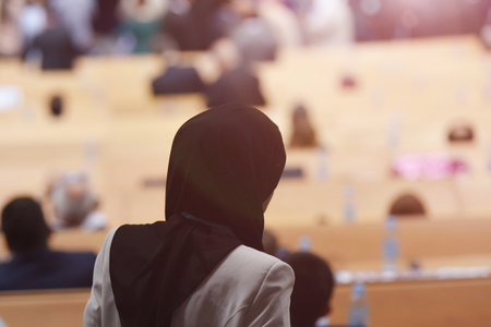 Muslim business woman having presentation during regional business investment conferenceの写真素材