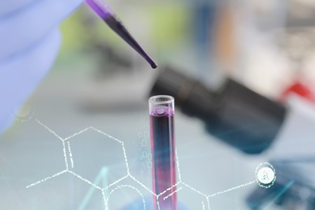 Young female Laboratory scientist working at lab with test tubes and microscope, test or research in clinical laboratory.Science, chemistry, biology, medicine and people concept.の写真素材