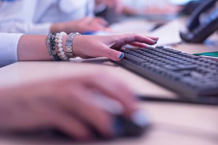 Security guard monitoring modern CCTV cameras in surveillance room. Group of  Female security guards in surveillance room.の写真素材