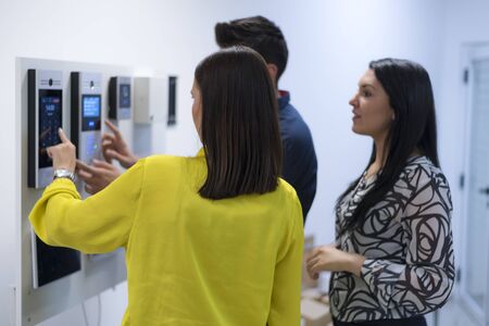 Group of  young handsome engineers working on electronics components.Tech tests electronic equipment in service center. Technologically Advanced Scientific Research Center.の写真素材