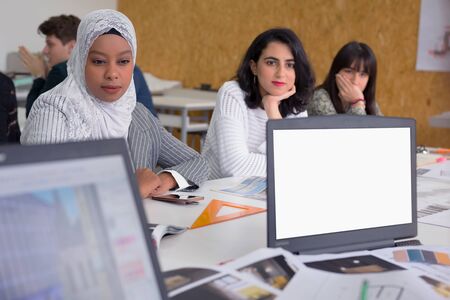 Group of  university architecture students working on practice lessons. Looking for solution during...