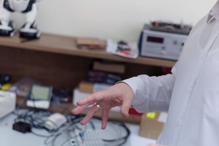 Engineering students working in the lab. Students are adjusting an electrical's components inside lab.の写真素材