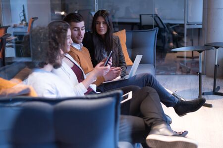 Meeting of co-workers and planning next steps of work. Young business group in discussion in their...