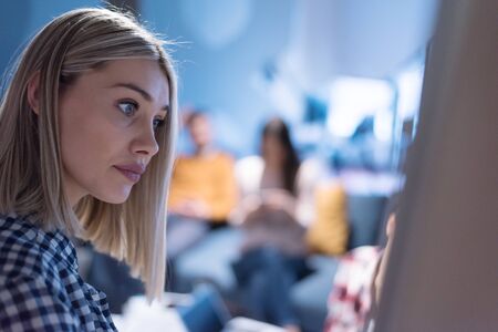 Beautiful Businesswoman Gives Report/ Presentation to Her Business Colleagues in the Conference Room.の写真素材