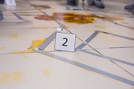 Forensic technicians taking DNA sample from blood stain with cotton swab on murder crime scene. Criminological expert collecting evidence at the crime scene. Law and police concept.の写真素材