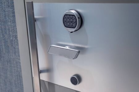 Bank vault door with  security code for alarm system. Deposit cell safe box with code lock.