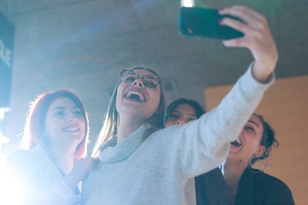 Group of young multiethnic Business people doing selfie during cafffe brake.の写真素材