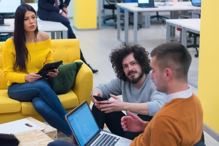 Multiracial young creative people in modern office. Group of young business people are working...