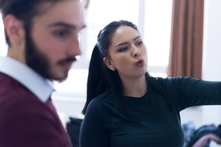 Two young female and male economy students analyzing company annual financial report balance and prepairing for test. Concept of economy, education. market.の写真素材