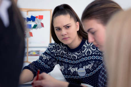 Female Architecture teacher at work. Female professor explain architectural projects to students....