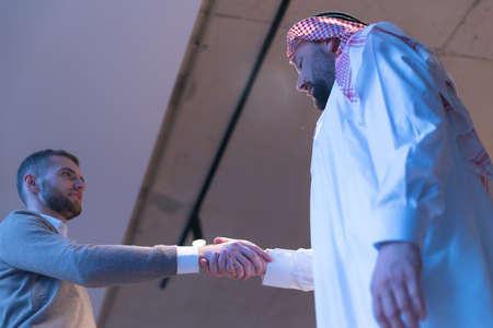 Arab Businessmen's Handshake with American Businessman Descent. Confirmation of Business alliance...