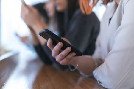 Startup Diversity Teamwork Brainstorming Meeting Concept. Business Team Coworkers discussing and Working Planning Start Up inside modern Cafe barの写真素材