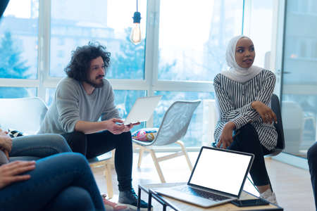 Startup Marketing Idea Presentation. Group of Young multiethnic Coworkers Making Great Business Decisions. Creative Team Discussion Corporate Work Concept inside Modern Office.の写真素材