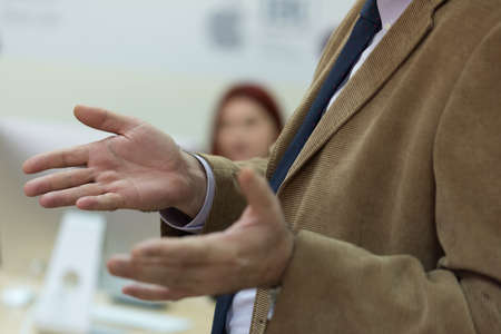 Selective focus on  teacher  while teaching and explaining lessons to students in classroom....