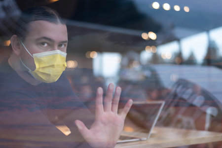 Covid-19 Situation in Business Concept. Businessman with Surgical Mask. Working on Computer Laptop....