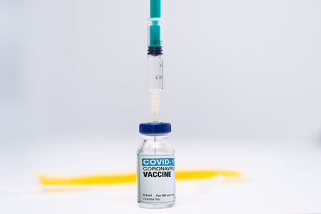 Covid-19 Corona Virus 2019-ncov vaccine vials medicine drug bottles syringe injection. Vaccination,...