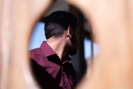 African Muslim Man Making Traditional Prayer To God. Religious black muslim man praying inside the mosque during ramadanの写真素材