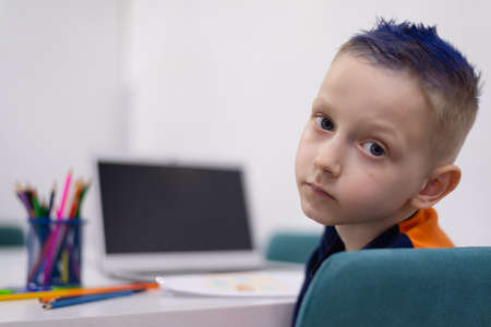 School boy working from home. Back to school concept after pandemic situation.