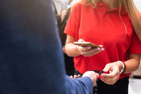 Event QR code ticket scanning before begining of business conferenceの写真素材