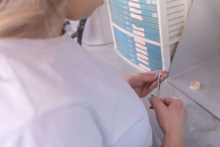 Dental prosthesis, dentures, prosthetics work. A study and a table with dental toolsの写真素材