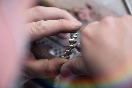 Dental prosthesis, dentures, prosthetics work. A study and a table with dental toolsの写真素材