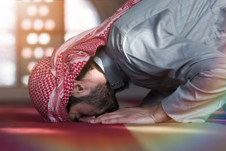 Muslim Arabic man praying. Religious muslim man praying inside the mosque during ramadanの写真素材