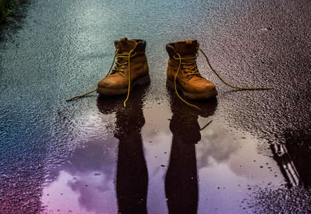 Boots on wet floorの写真素材