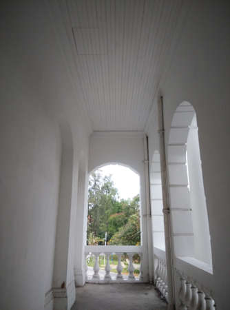 Balcony - white old historical British Colonial building, empty and abandoned.の写真素材