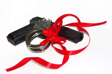 Gun and handcuffs for giftの写真素材