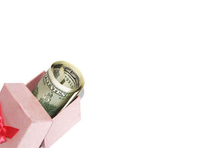 paper bag with american dollars and red ribon bow decoration christmas shoppingの写真素材