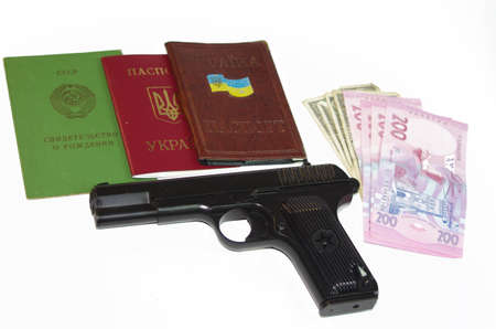 A hand Gun, Passport and Money set on a white background base 