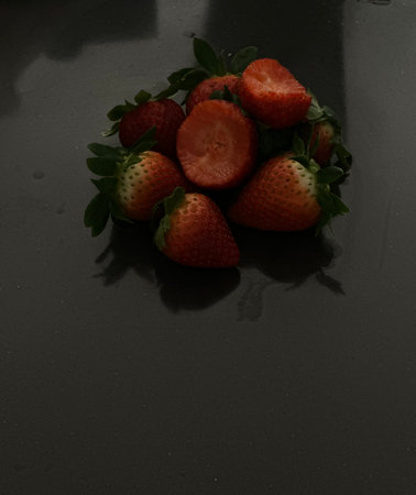 Strawberries on a black background. Fresh strawberries on a black background.の写真素材