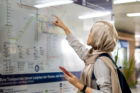 Asian muslim woman on subway train transit system public. Public transport concept