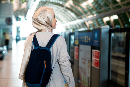 Asian muslim woman on subway train transit system public. Public transport conceptの写真素材