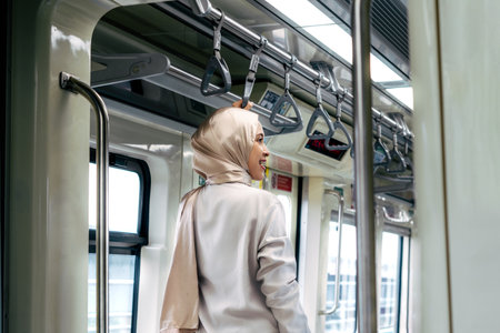 Asian muslim woman on subway train transit system public. Public transport conceptの写真素材