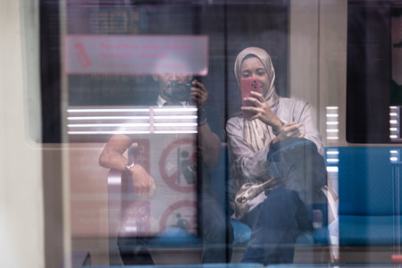 Asian muslim woman on subway train transit system public. Public transport conceptの写真素材