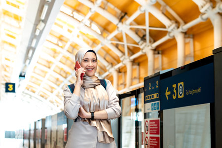 Asian muslim woman on subway train transit system public. Public transport concept