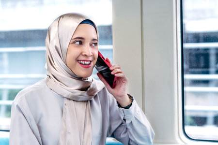 Asian muslim woman on subway train transit system public. Public transport conceptの写真素材