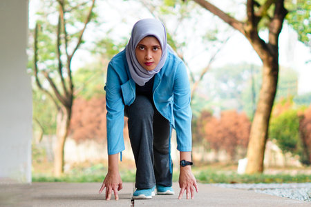 Young beautiful asian female running outdoor. Workout exercise in the morning. Healthy and active lifestyle concept.の写真素材