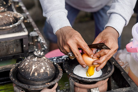 Street Food Delight. Making Serabi Pancakes on Traditional Stove