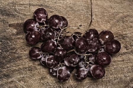 Grapes on wooden table.の写真素材