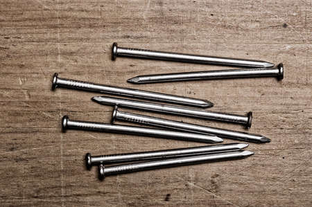 nails on wooden table.の写真素材