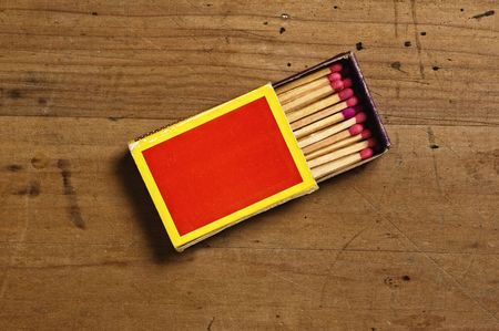Matchbox on old table.